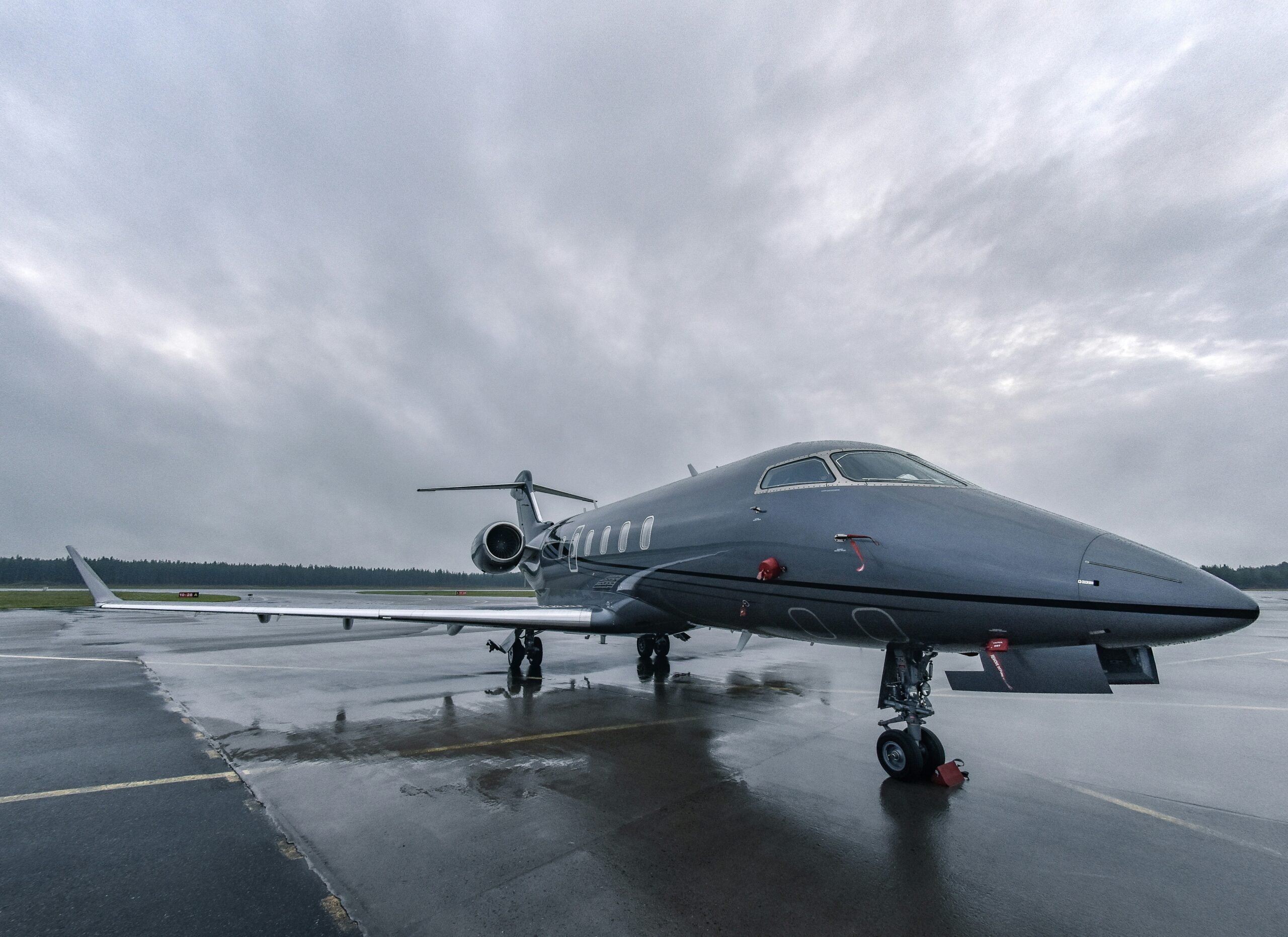 Private jet on the runway before departure with passenger luggage onboard