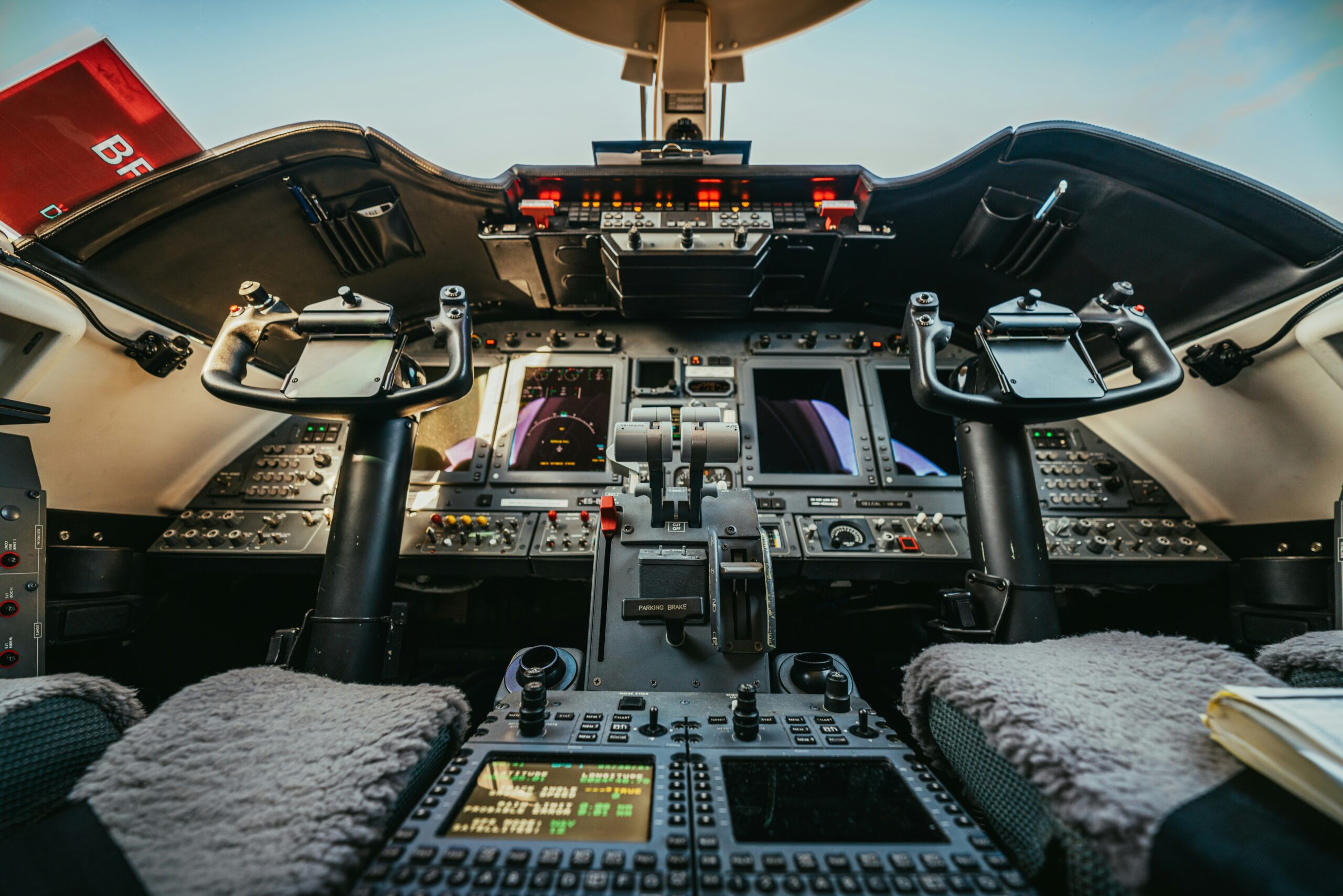 Private jet cockpit showcasing advanced navigation systems for long-range flights