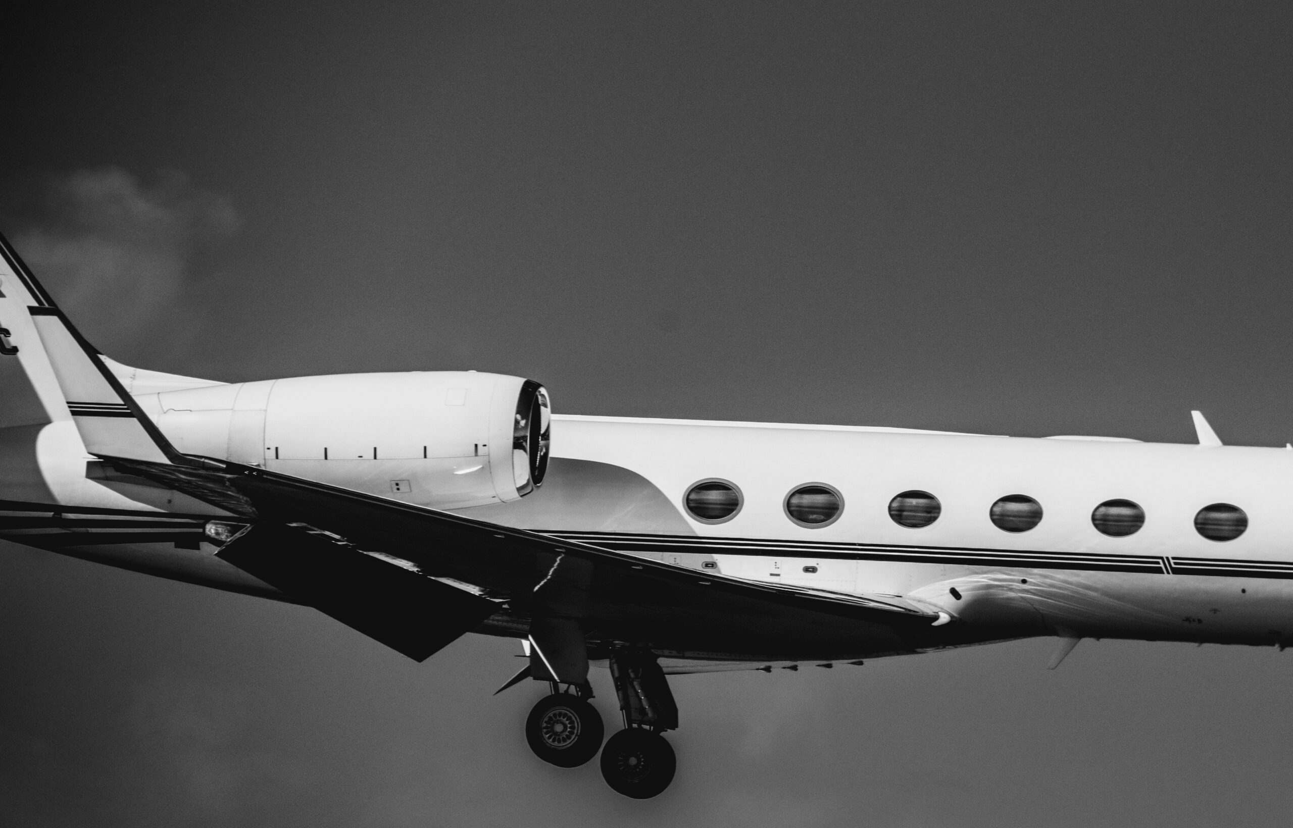 Private jet approaching the runway, highlighting the aircraft available when you book a private jet for business or leisure travel.