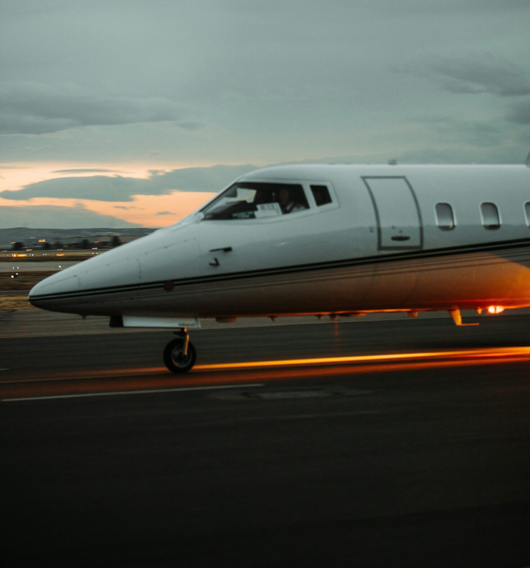 Private jet preparing for departure on the runway during a private jet charter flight.