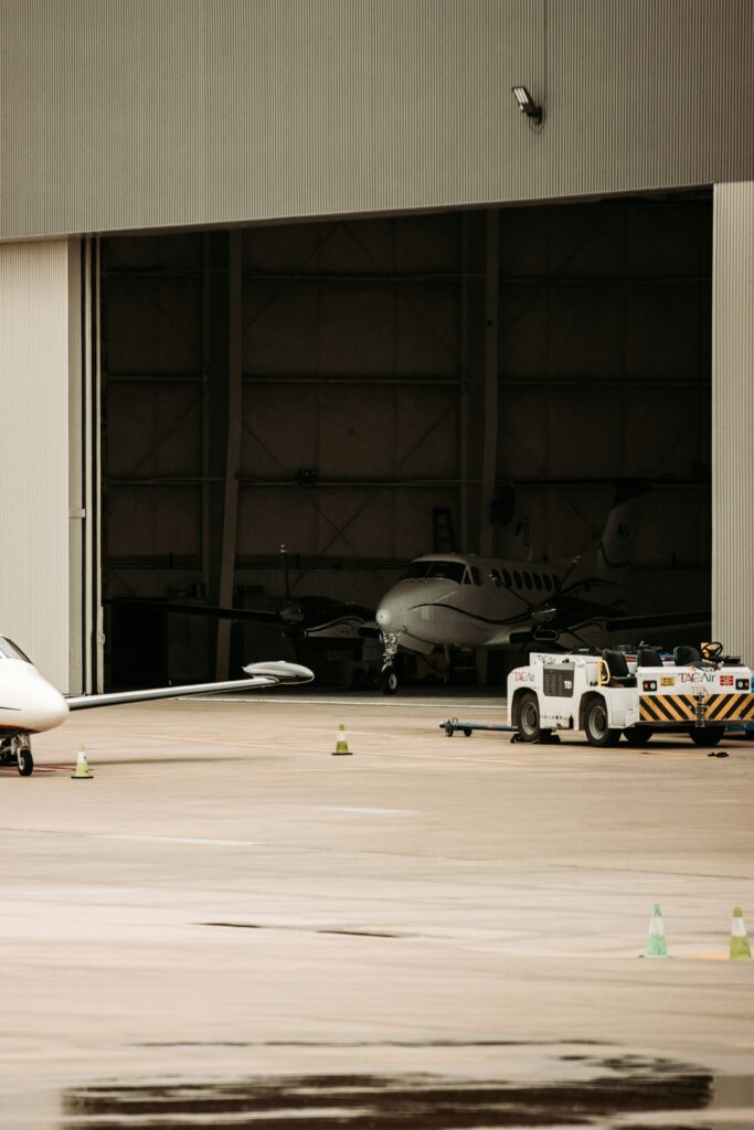 Business jet parked inside a private aircraft hangar